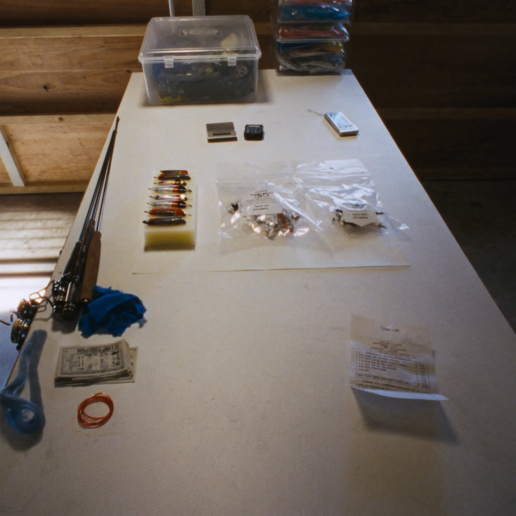 Photorealistic affordable bass fishing gear and tackle on a workbench